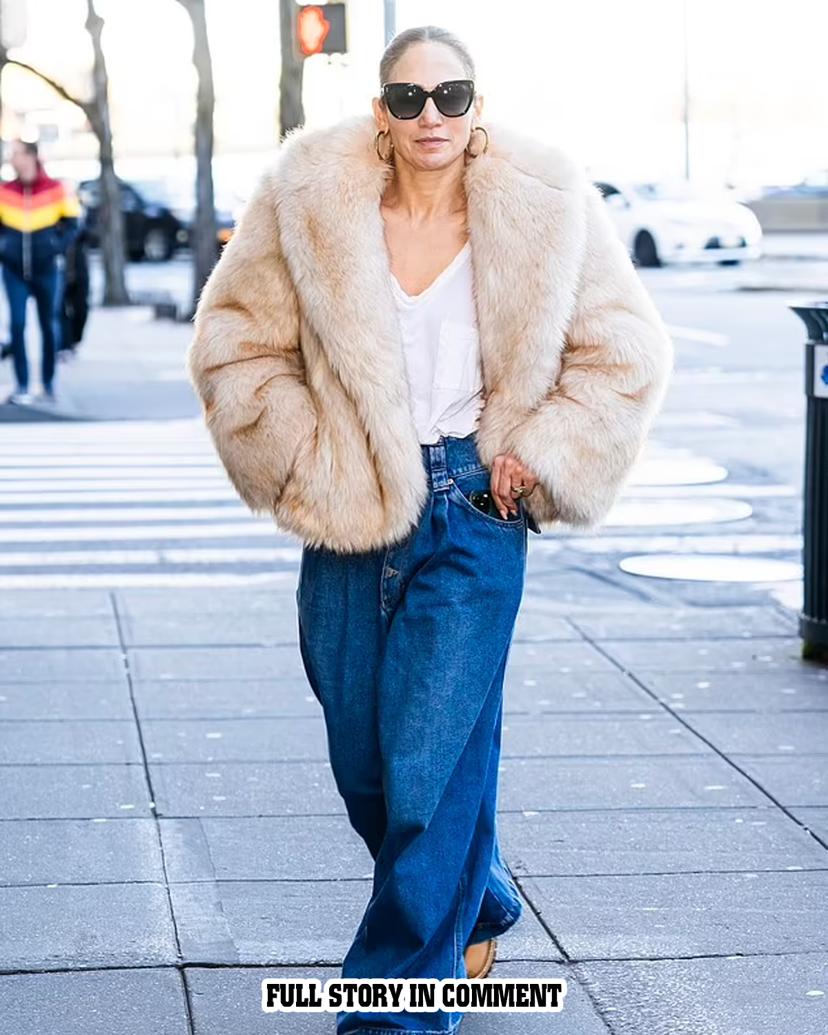 Jennifer Lopez bundles up in glamorous faux fur coat and wide-leg jeans ...